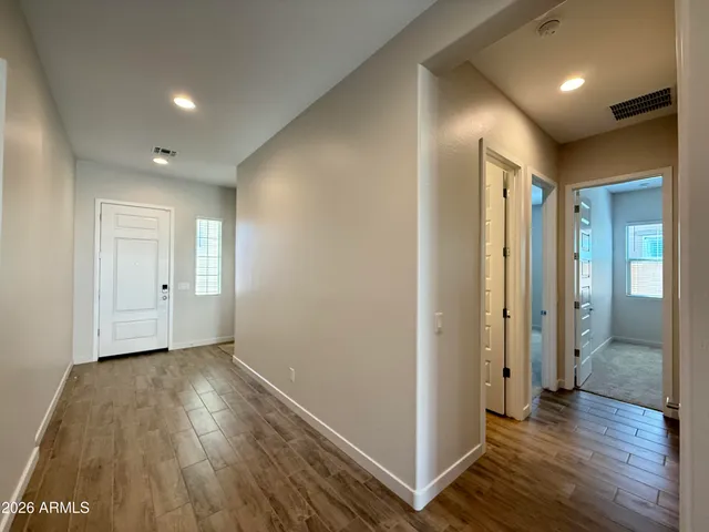 a view of hallway with a wooden floor