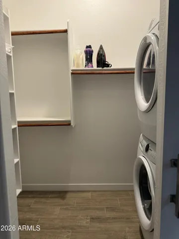 a view of a hallway with washer and dryer