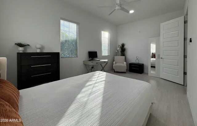 a bedroom with a bed and dresser