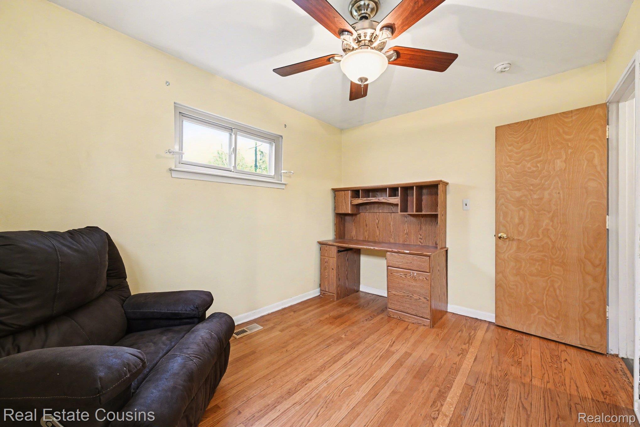 32224 Joy Road Livonia, MI 48150 - Photo 12 of 33 Living area featuring light wood finished floors, a desk, and a ceiling fan