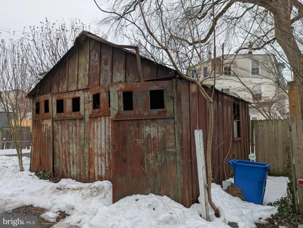 a view of a house with a large tree