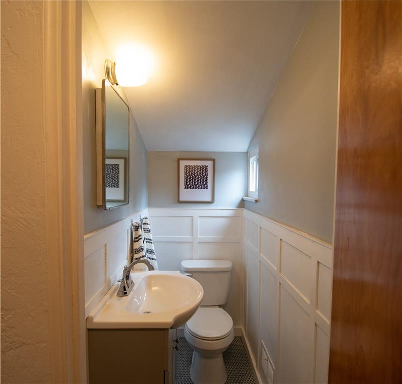 402 Fort Couch Road Pittsburgh, PA 15241 - Photo 14 of 25 blue/grey penny tile, white wainscoting, grey vanity and a new toilet make this space ideal for anyone!
