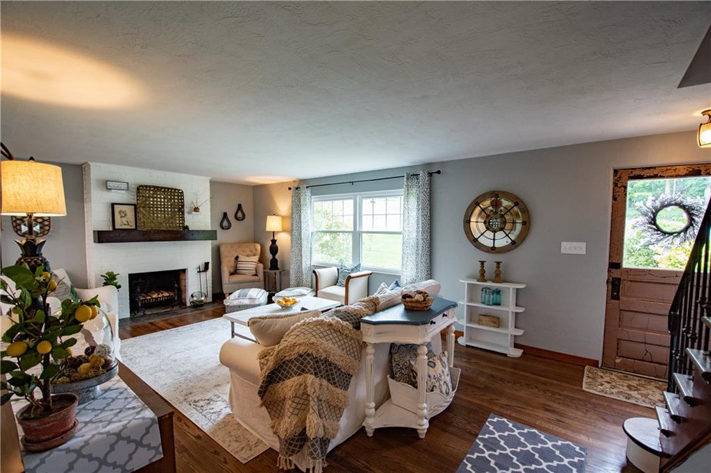 402 Fort Couch Road Pittsburgh, PA 15241 - Photo 3 of 25 Another view of this gorgeous and comfortable room, warm and cozy log fireplace sets the stage along w the custom mantle piece!