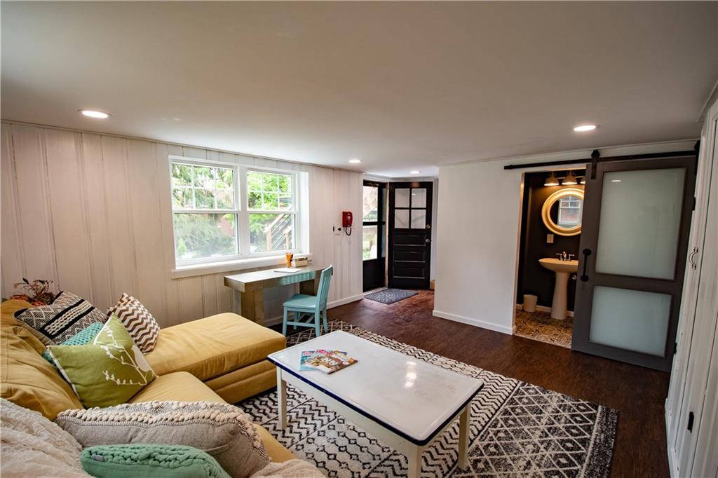 402 Fort Couch Road Pittsburgh, PA 15241 - Photo 21 of 25 This is such a amazing space, can be a gym or home office, walkout to the back patio while you work from home, have friends or clients enter the back patio area for a outdoor meeting, along the concrete walk way, or use this space for a guest or nanny space w its full bath, to the right the entire wall is closets and further right is an entire room for tools, equipment, holiday dcor, etc,this house just keeps going the storage is insane!