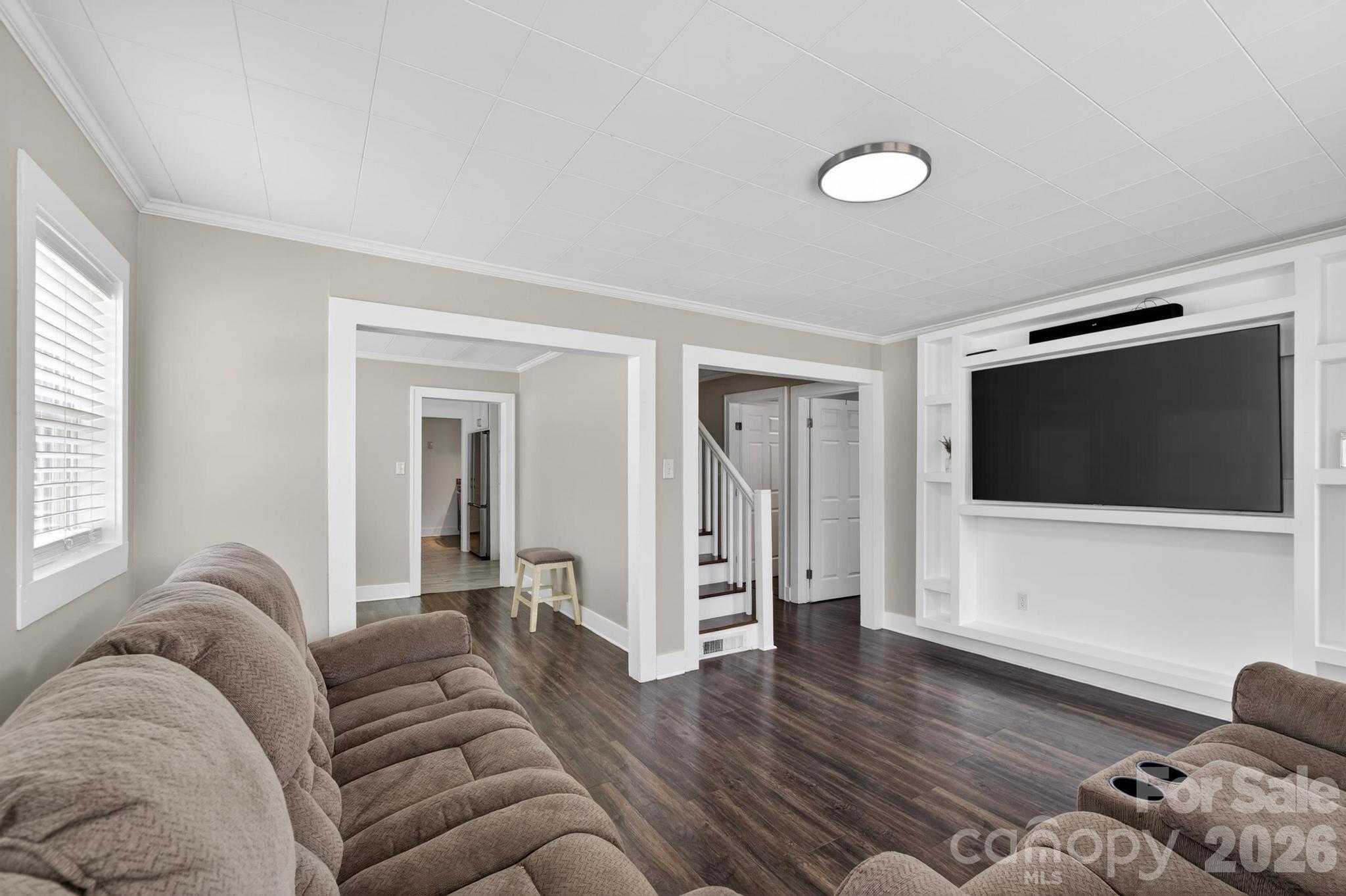 2076 Connelly Springs Road Lenoir, NC 28645 - Photo 6 of 47 a living room with furniture and a flat screen tv