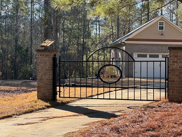 Lot 16 Oak Ridge Drive Waverly Hall, GA 31831 - Photo 9 of 13 a view of a brick house with a large window and palm tree