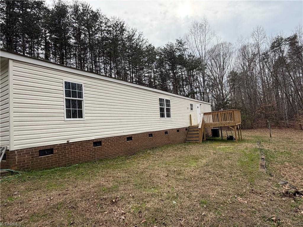 670 Foxwood Road Madison, NC 27025 - Photo 3 of 15 Back view of hoe with spacious backyard