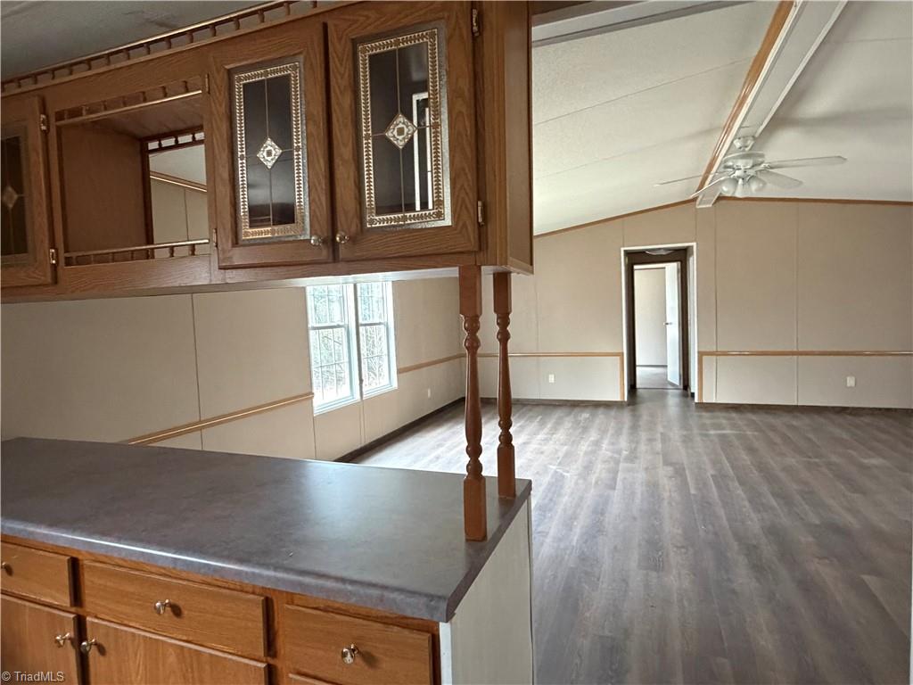 670 Foxwood Road Madison, NC 27025 - Photo 6 of 15 View from Kitchen area…. Counterspace, cabinets galore …. Great room ahead and dining room to the right