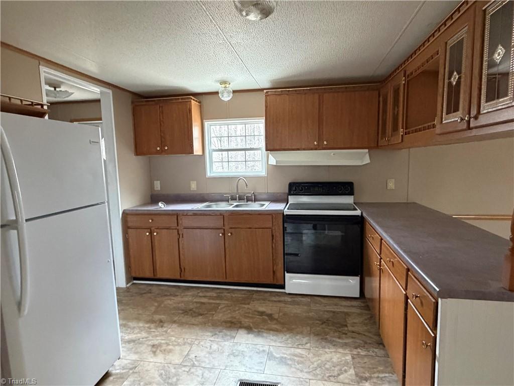 670 Foxwood Road Madison, NC 27025 - Photo 8 of 15 From of kitchen from the dining room.