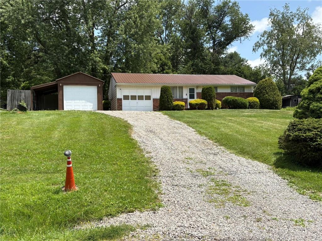 347 Howes Run Road Sarver, PA 16055 - Photo 1 of 16 a house view with a garden space