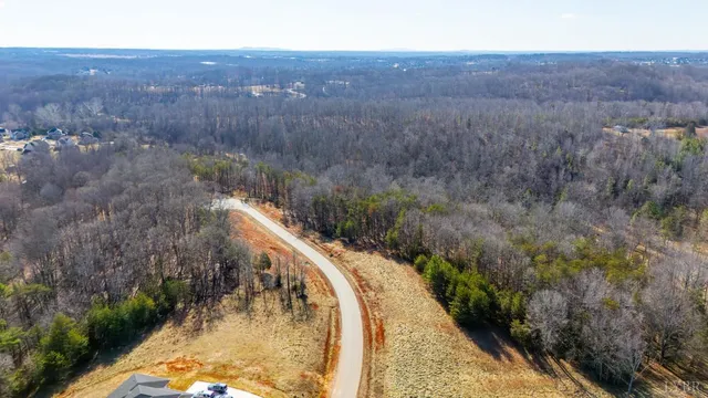 a view of a backyard with wooden fence
