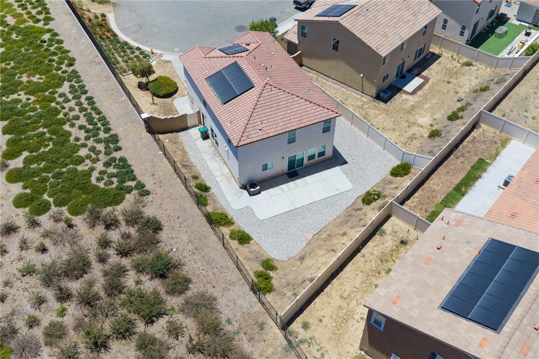 20130 Curaco Court Riverside, CA 92507 - Photo 6 of 43 Aerial rear view highlighting the fenced yard and concrete patio.