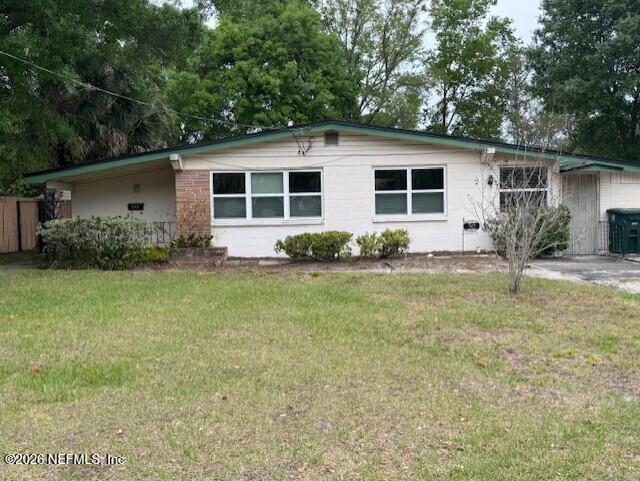 7915 Fresca Street Jacksonville, FL 32217 - Photo 1 of 20 a view of a backyard with plants and large tree