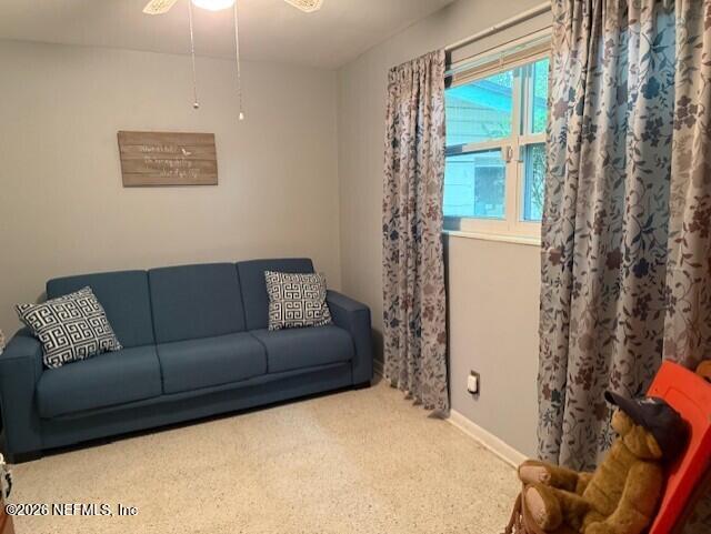 7915 Fresca Street Jacksonville, FL 32217 - Photo 13 of 20 a living room with furniture and a window