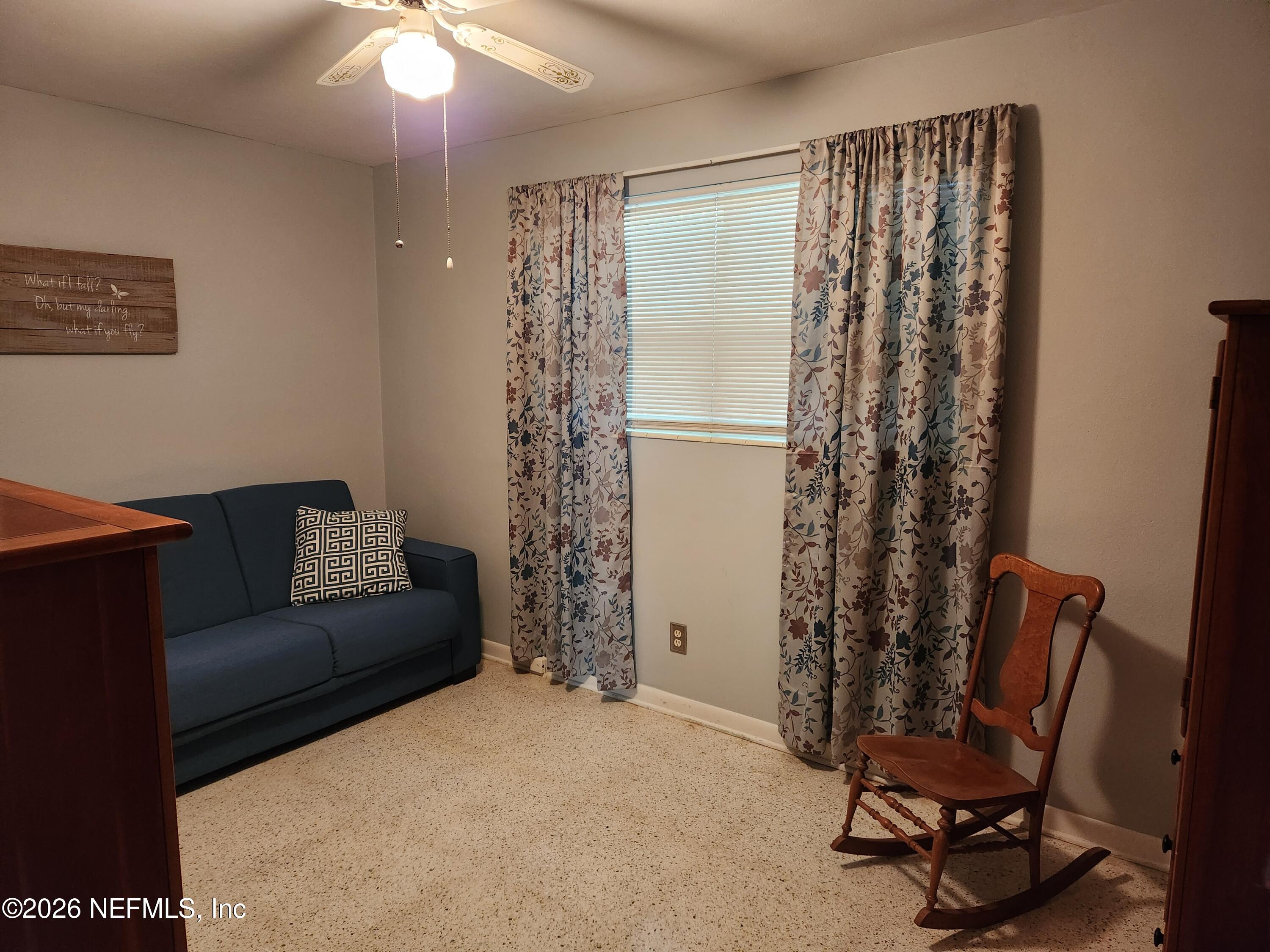 7915 Fresca Street Jacksonville, FL 32217 - Photo 14 of 20 a view of a livingroom with furniture and a window