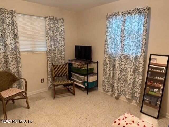 7915 Fresca Street Jacksonville, FL 32217 - Photo 15 of 20 a living room with furniture and a flat screen tv