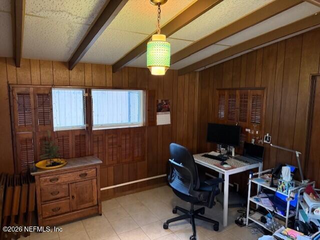 7915 Fresca Street Jacksonville, FL 32217 - Photo 17 of 20 a workspace with furniture and chandelier