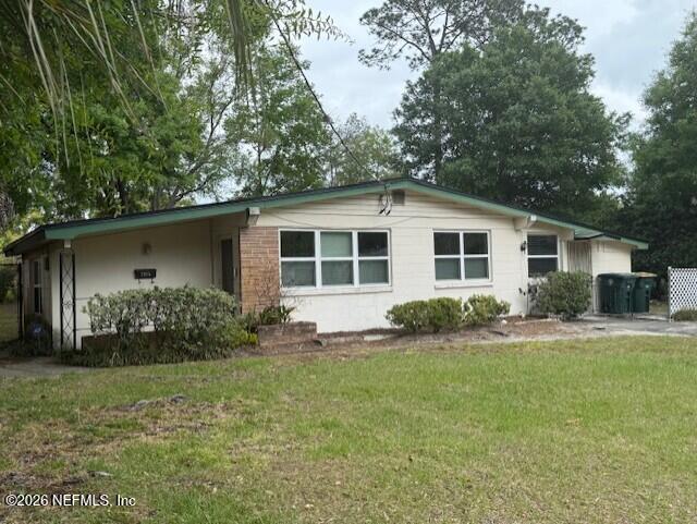 7915 Fresca Street Jacksonville, FL 32217 - Photo 2 of 20 a view of a house with a yard