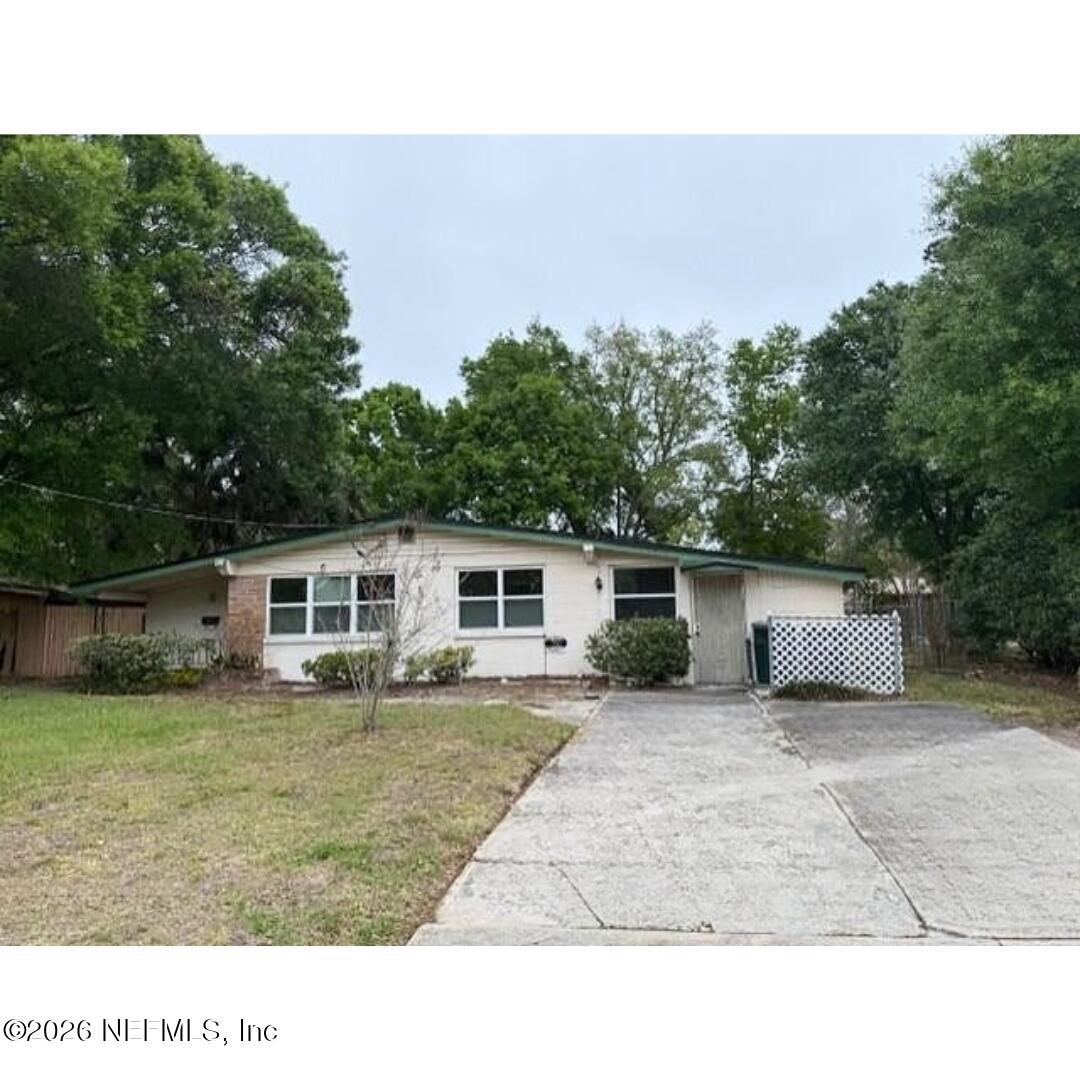 7915 Fresca Street Jacksonville, FL 32217 - Photo 3 of 20 a house view with a garden space