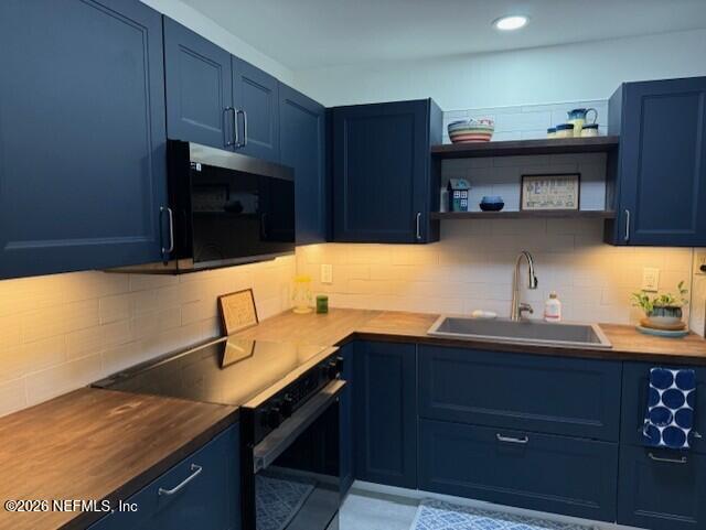 7915 Fresca Street Jacksonville, FL 32217 - Photo 5 of 20 a kitchen with a sink and cabinets