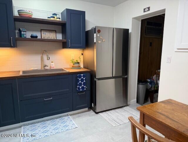 7915 Fresca Street Jacksonville, FL 32217 - Photo 6 of 20 a kitchen with stainless steel appliances granite countertop a refrigerator and a sink