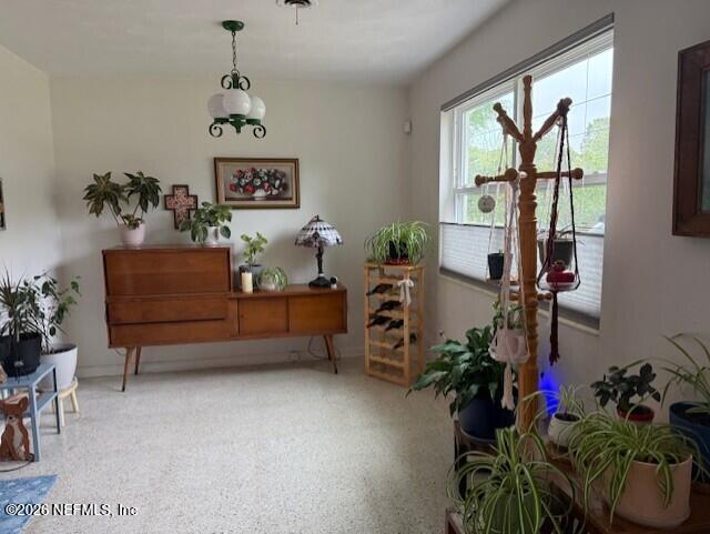 7915 Fresca Street Jacksonville, FL 32217 - Photo 7 of 20 a very nice looking room with a large window and potted plants