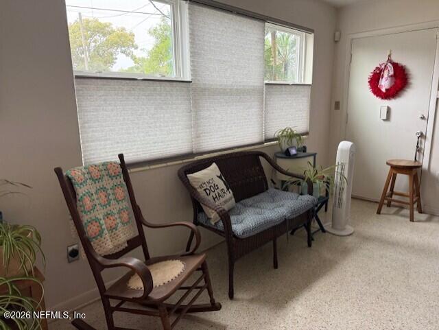 7915 Fresca Street Jacksonville, FL 32217 - Photo 8 of 20 a dining room with furniture and a window