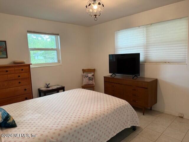 7915 Fresca Street Jacksonville, FL 32217 - Photo 10 of 20 a bedroom with a bed and a flat screen tv