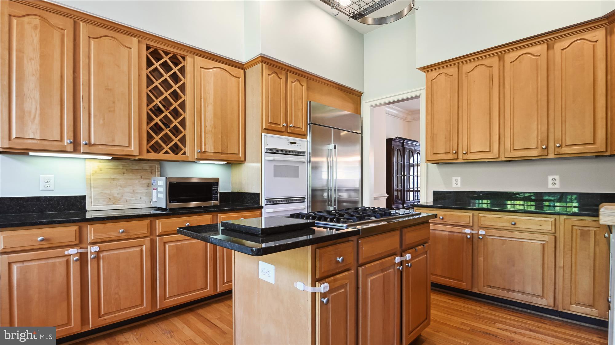 7905 Turncrest Drive Potomac, MD 20854 - Photo 13 of 56 Kitchen has sky high ceilings and cooktop island