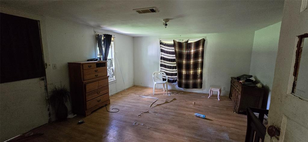 409 Elm Street Cullen, LA 71075 - Photo 5 of 12 a view of empty room with wooden floor