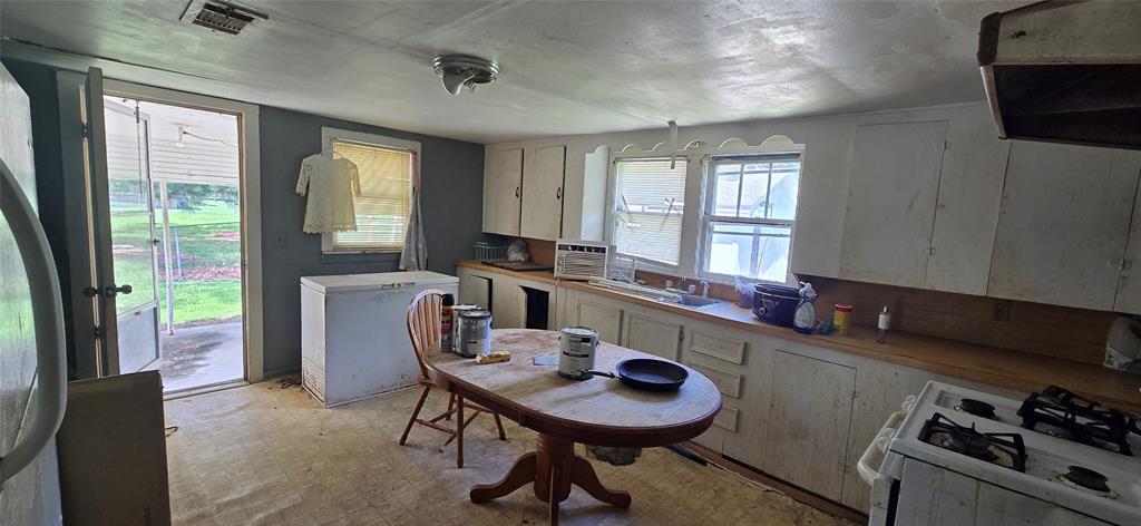 409 Elm Street Cullen, LA 71075 - Photo 8 of 12 a room with furniture a window and a sink