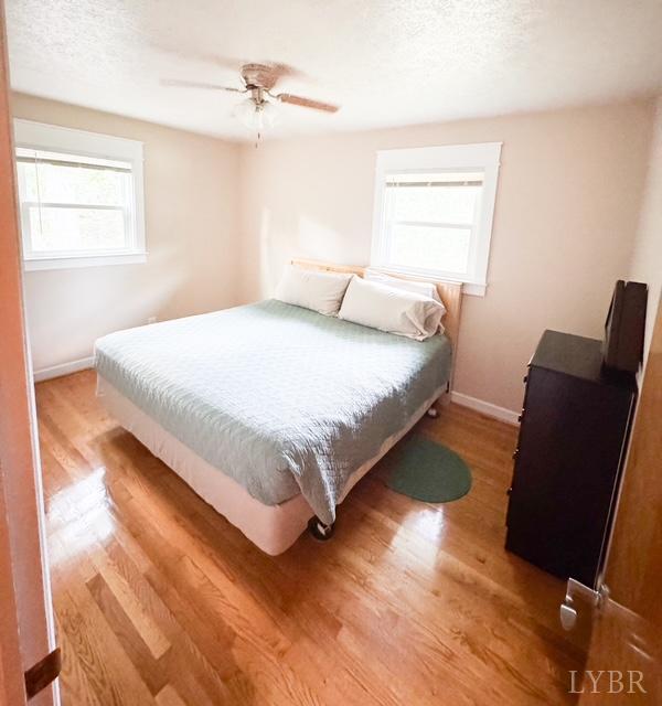 617 Spring Street Hurt, VA 24563 - Photo 11 of 19 a bed sitting in a bedroom next to a window