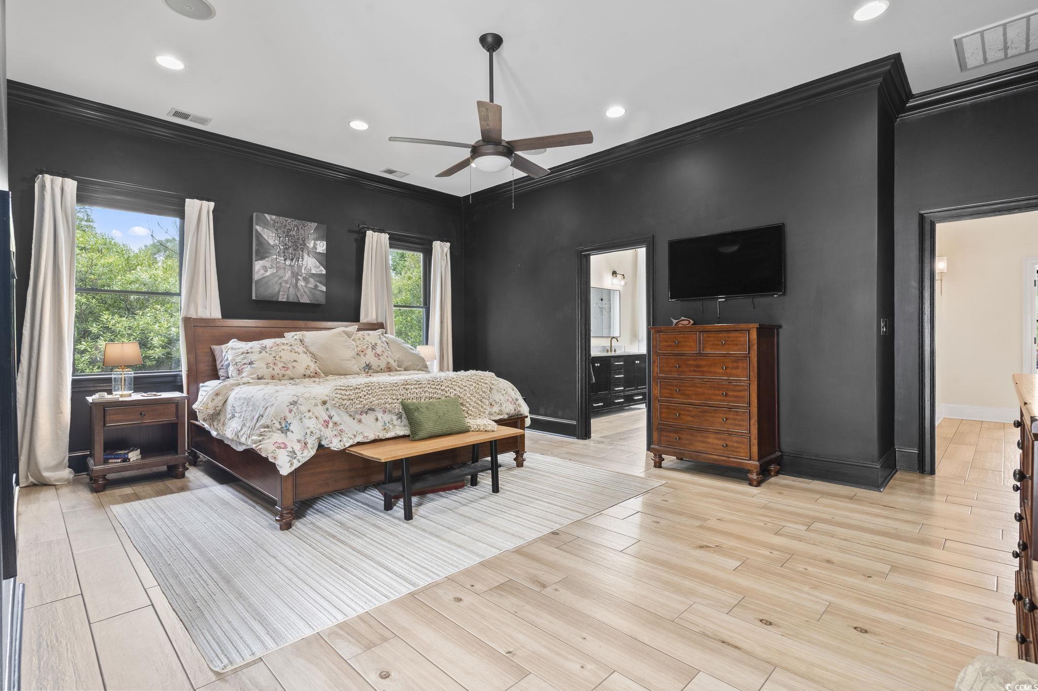 9449 Freewoods Road Myrtle Beach, SC 29588 - Photo 16 of 39 Bedroom featuring ornamental molding, baseboards, recessed lighting, light wood-style floors, and ensuite bath