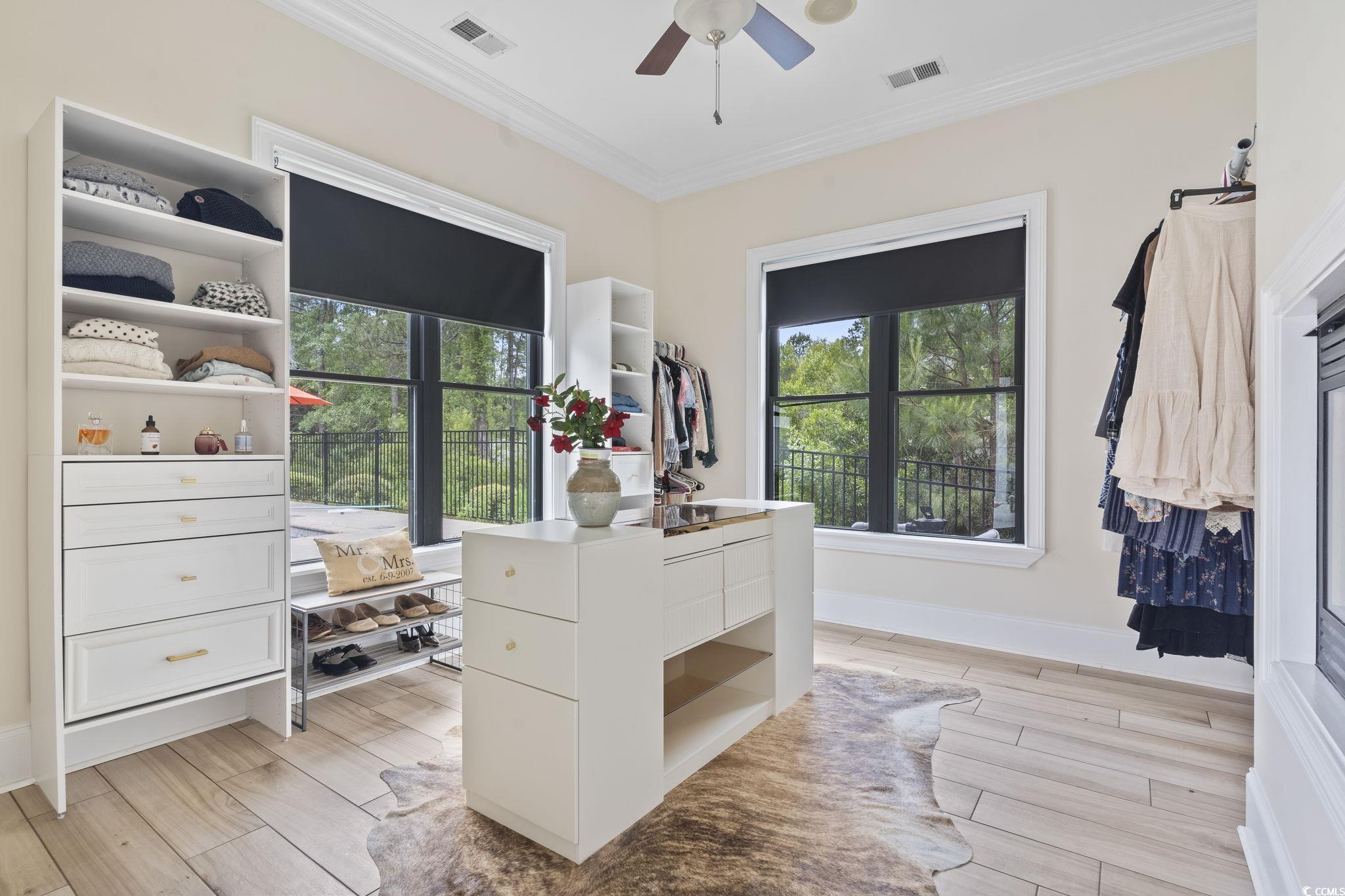 9449 Freewoods Road Myrtle Beach, SC 29588 - Photo 17 of 39 Spacious closet featuring a ceiling fan and light wood-style floors