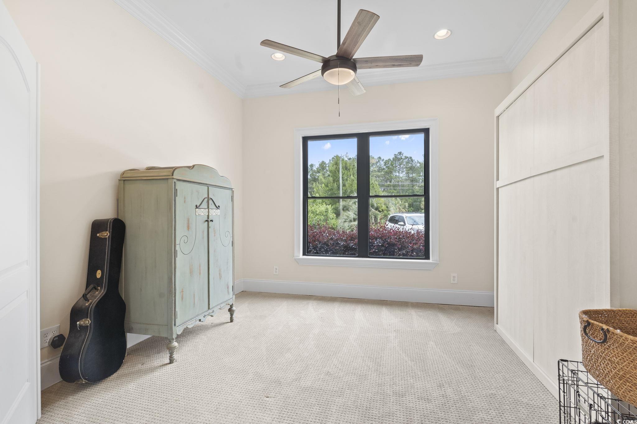 9449 Freewoods Road Myrtle Beach, SC 29588 - Photo 27 of 39 Bedroom featuring light colored carpet, crown molding, baseboards, recessed lighting, and ceiling fan