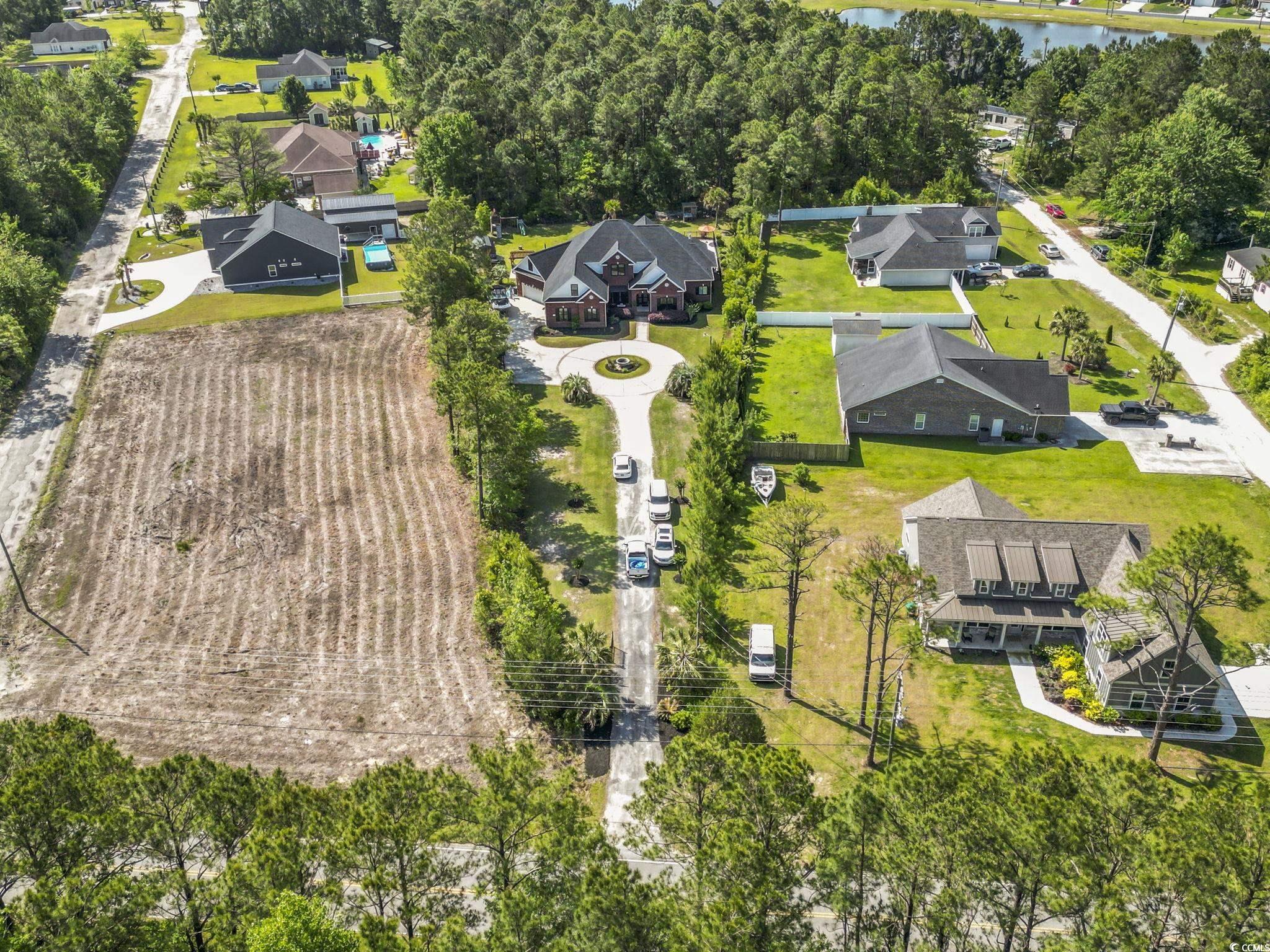 9449 Freewoods Road Myrtle Beach, SC 29588 - Photo 37 of 39 Birds eye view of property featuring a water view and a residential view