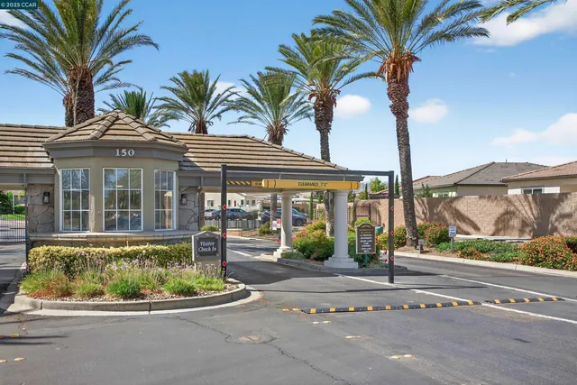 a front view of house with a garden