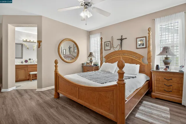 a bed room with a bed and a chandelier