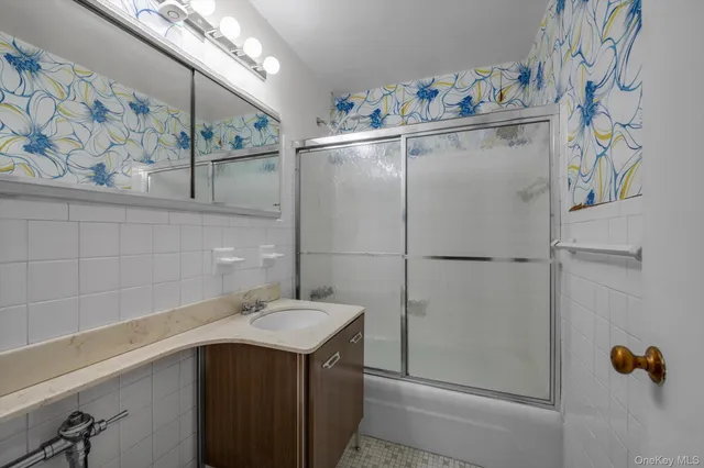a bathroom with a sink and mirror