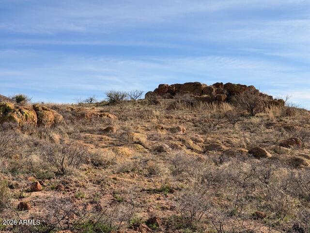 Tbd East Dougherty Road, Unit 207 Pearce, AZ 85625 - Photo 8 of 13 a view of a large building with a field