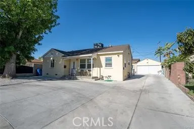 a front view of a house with a yard and a garage
