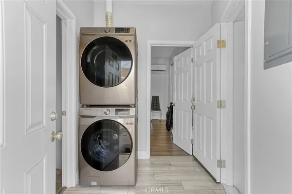 a view of a hallway with washer and dryer