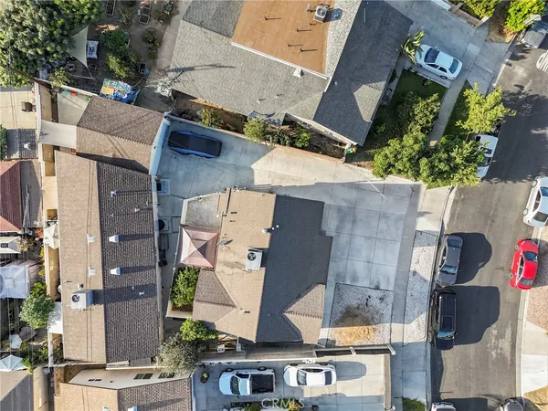 an aerial view of residential houses with outdoor space