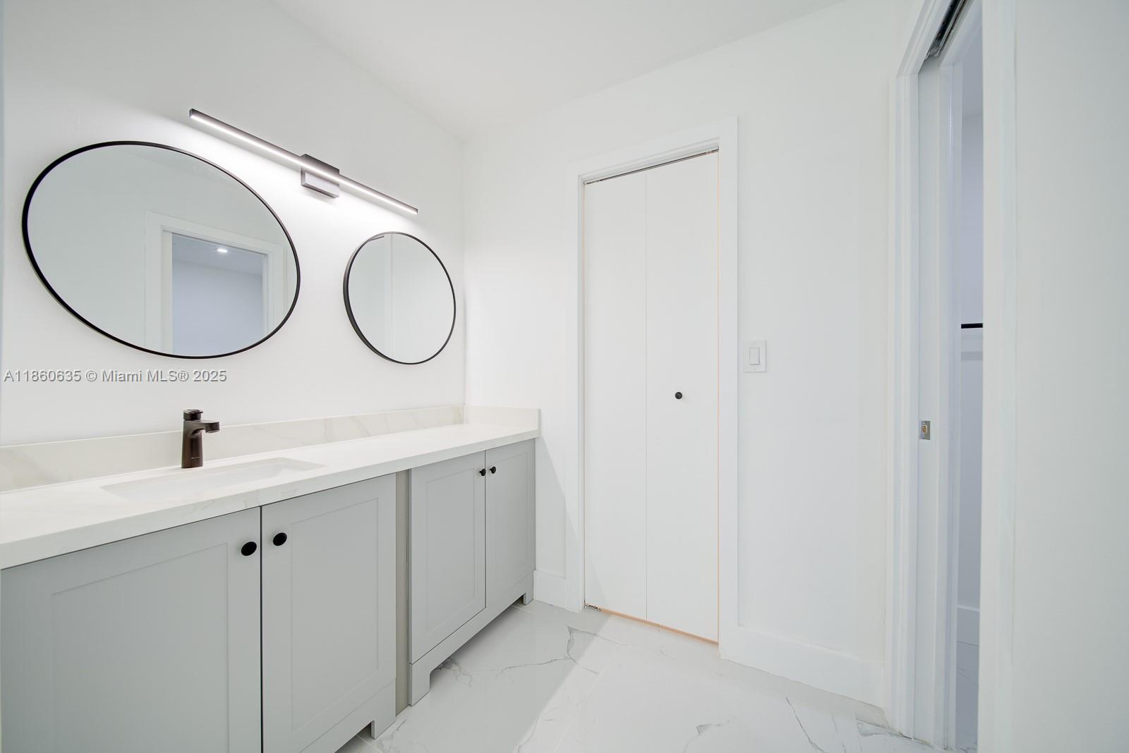 14850 Naranja Lakes Boulevard, Unit B1P Homestead, FL 33032 - Photo 13 of 21 a bathroom with a sink and a mirror