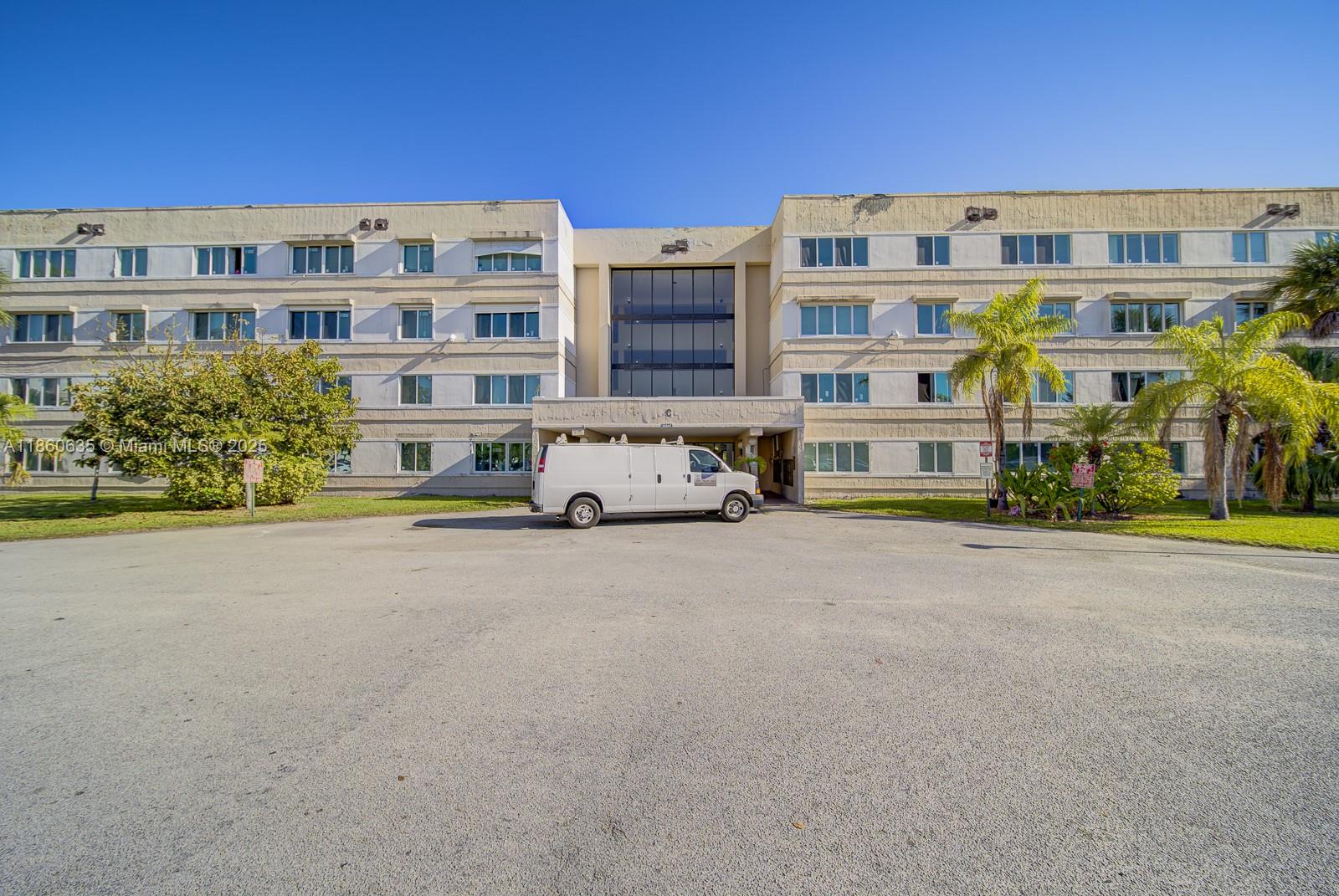 14850 Naranja Lakes Boulevard, Unit B1P Homestead, FL 33032 - Photo 20 of 21 a car parked in front of a building