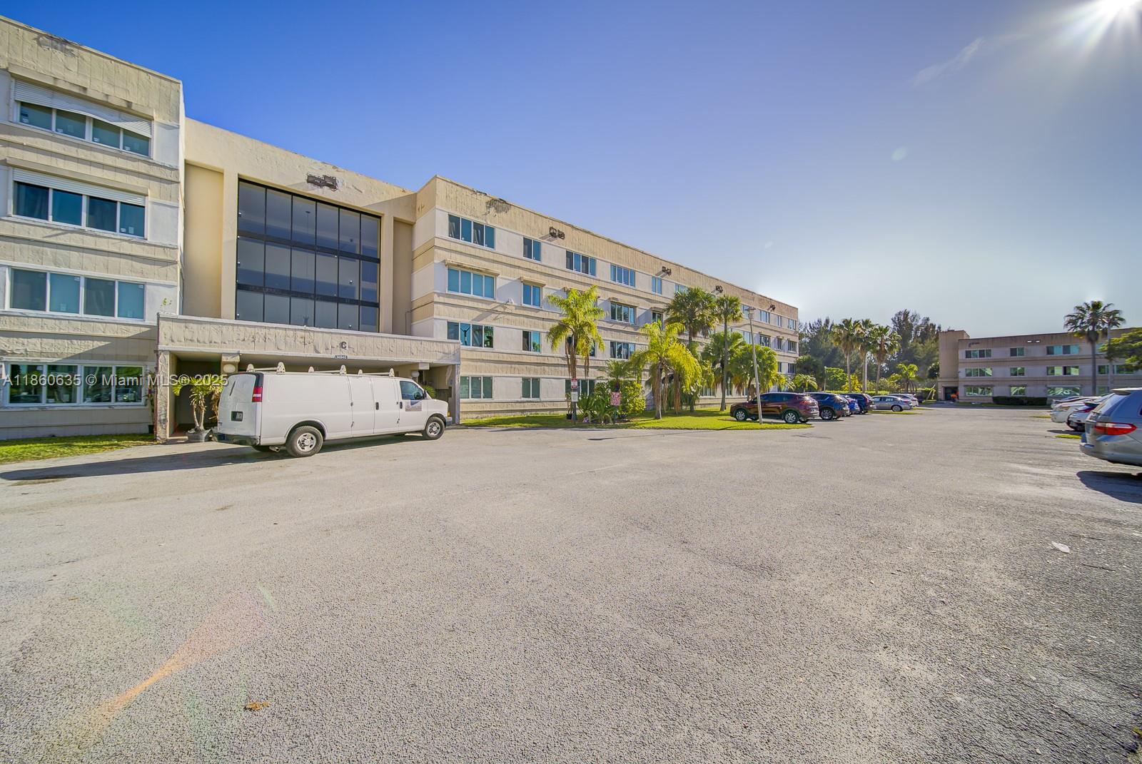 14850 Naranja Lakes Boulevard, Unit B1P Homestead, FL 33032 - Photo 21 of 21 a view of building with cars parked