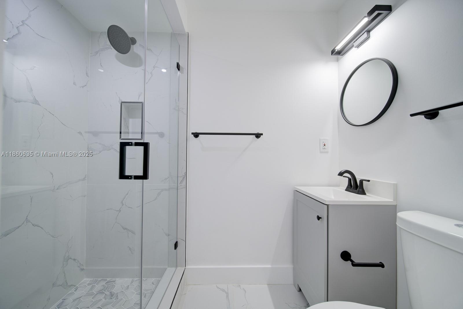 14850 Naranja Lakes Boulevard, Unit B1P Homestead, FL 33032 - Photo 5 of 21 a bathroom with a sink and a mirror