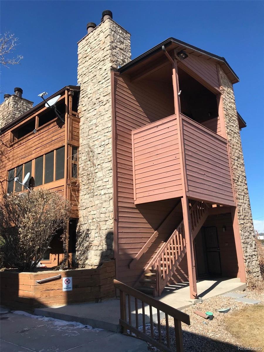 4661 South Decatur Street, Unit 206 Englewood, CO 80110 - Photo 1 of 17 a view of house with wooden fence
