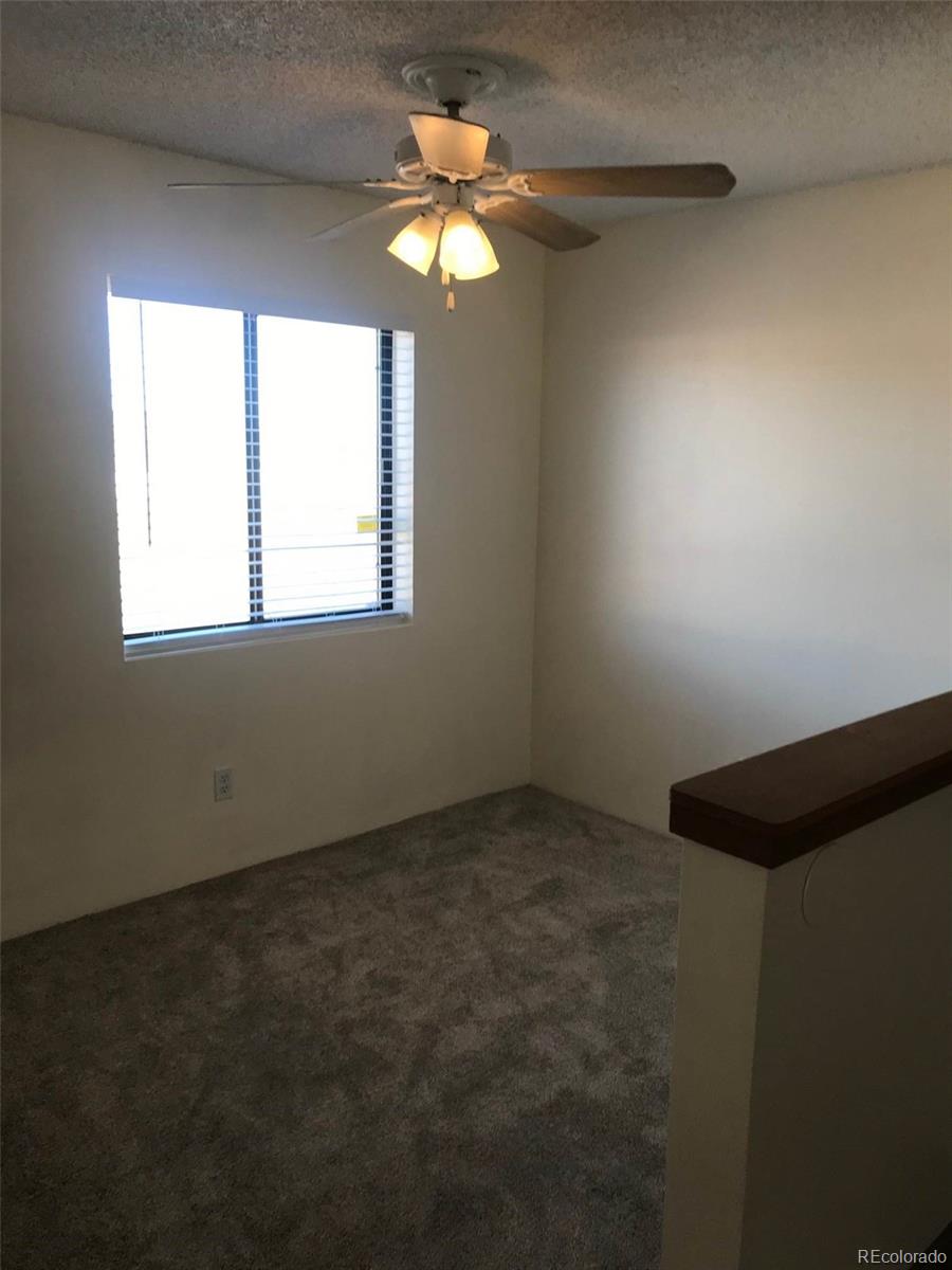 4661 South Decatur Street, Unit 206 Englewood, CO 80110 - Photo 9 of 17 a view of an empty room and window