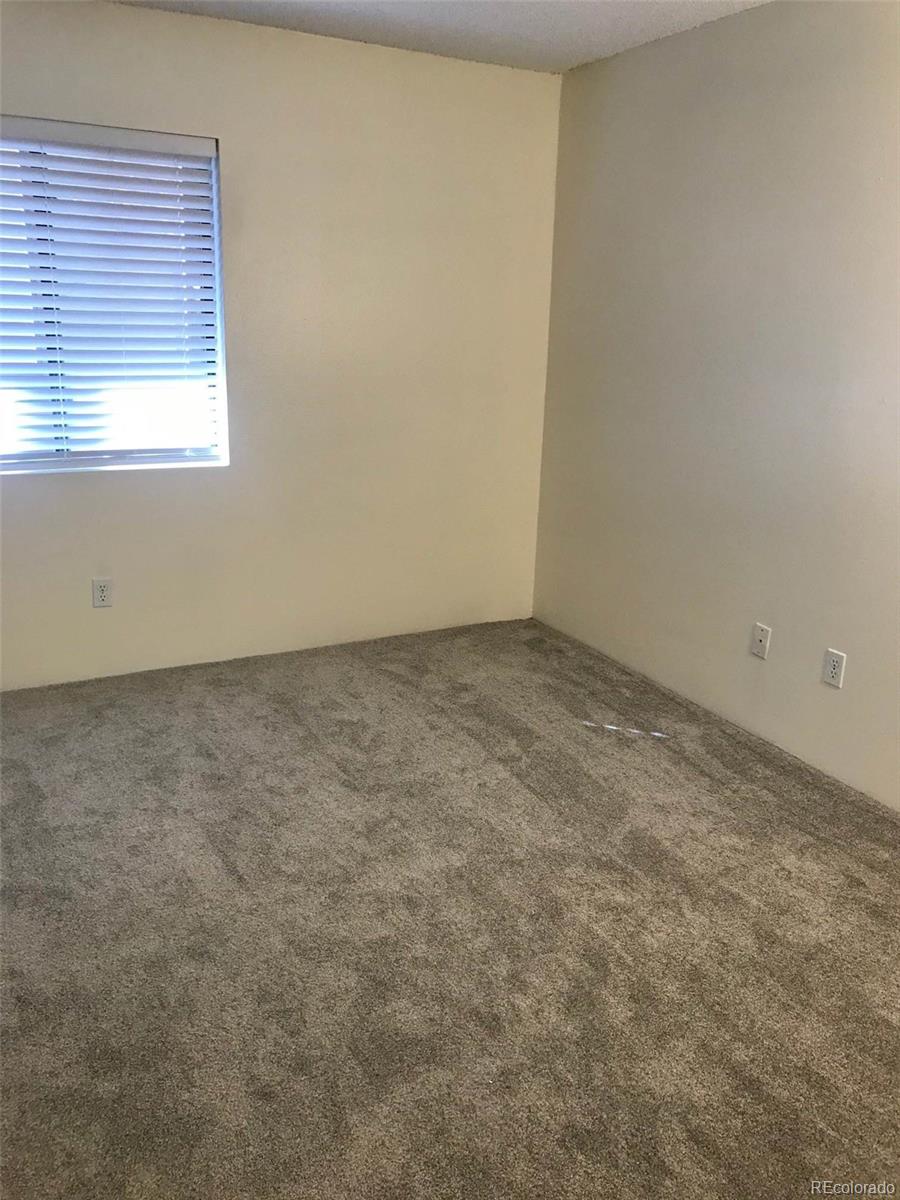 4661 South Decatur Street, Unit 206 Englewood, CO 80110 - Photo 10 of 17 an empty room with a window